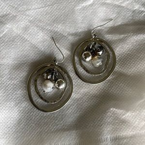 Silver plated, oblong hammered earrings.